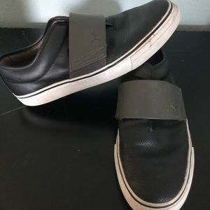 Black leather slip ons